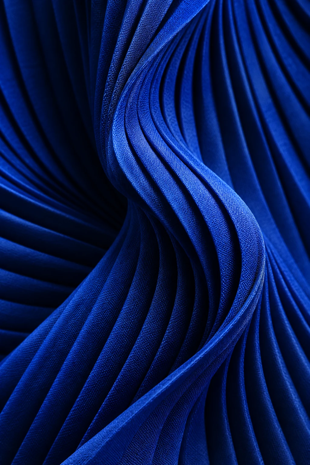 Sculptural waves of cobalt-blue woven fabric
